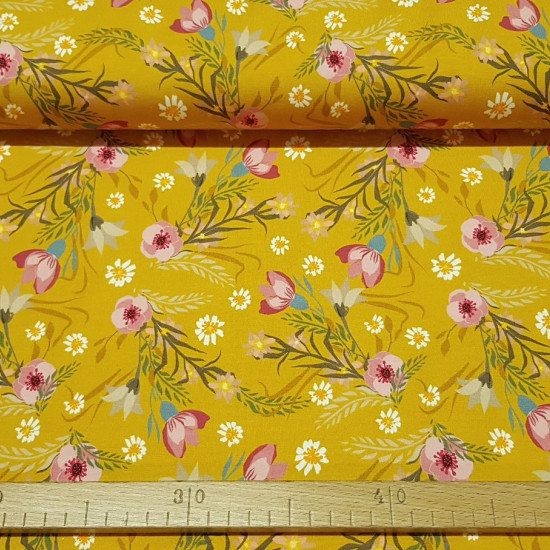 Cotton Jersey Flowers Ocher fabric - Stretch digital cotton jersey fabric with flower drawings on an ocher background. The fabric is 150cm wide and its composition 94% cotton - 6% elastane.
