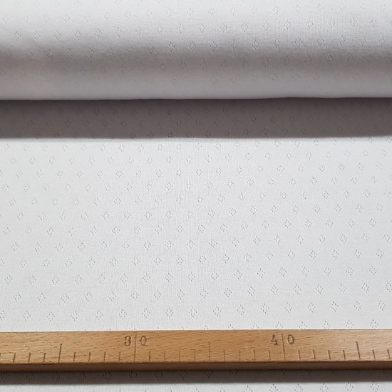 Pointoille Cotton Jersey fabric - Fine knit fabric with small openwork in the shape of diamonds, also called pointoille. It is used a lot in children's clothes, first clothes, underwear, bows... The fabric is 140cm wide and its composition is 100% co