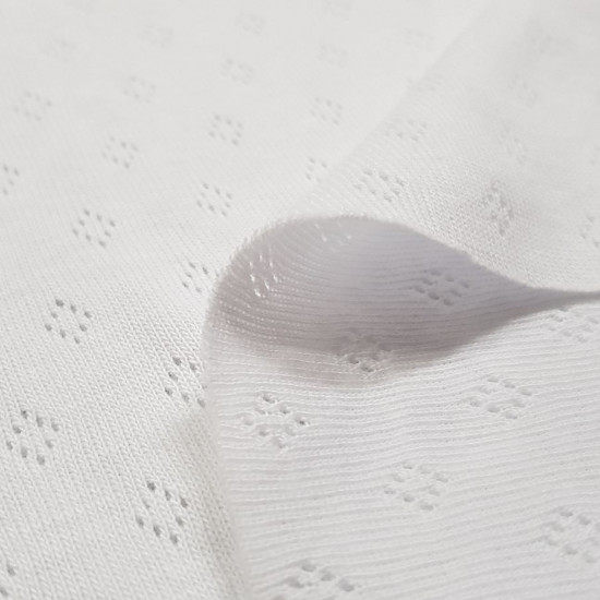 Pointoille Cotton Jersey fabric - Fine knit fabric with small openwork in the shape of diamonds, also called pointoille. It is used a lot in children's clothes, first clothes, underwear, bows... The fabric is 140cm wide and its composition is 100% co