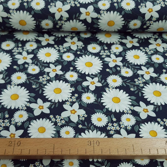 Cotton Jersey Flowers Daisies fabric - Digital printed cotton jersey fabric with drawings of daisy flowers on a navy blue background. The fabric is 150cm wide and its composition is 94% cotton - 6% elastane.