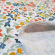 Tela Punto Camiseta Floral Eden - Tela de punto algodón orgánico tipo camiseta con dibujos florales sobre un fondo blanco. La tela mide 150cm de ancho y su composición 95% algodón – 5% elastano