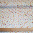 Cotton Jersey Little Bitty Flowers fabric - Organic cotton jersey fabric with drawings of small flowers on a white background. The fabric is 150cm wide and its composition is 95% cotton - 5% elastane.