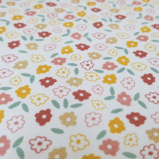 Cotton Jersey Little Bitty Flowers fabric - Organic cotton jersey fabric with drawings of small flowers on a white background. The fabric is 150cm wide and its composition is 95% cotton - 5% elastane.
