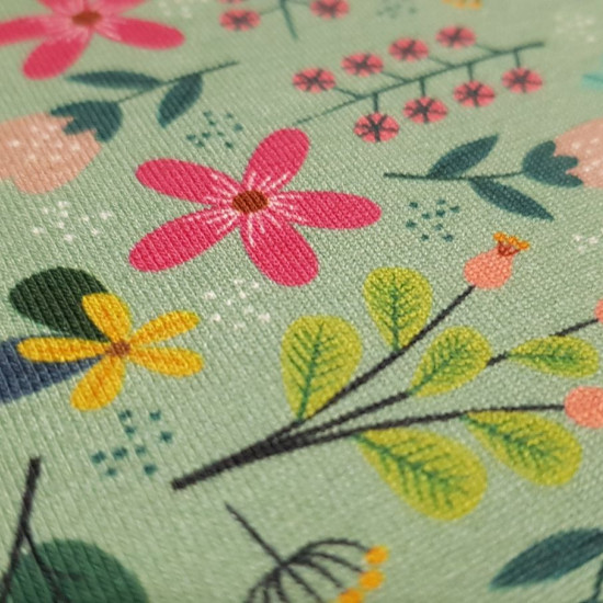 Cotton Jersey Summer Flowers fabric - Digital print cotton jersey fabric with drawings of summer flowers on a old green background. The fabric is 150cm wide and its composition is 94% cotton - 6% elastane.