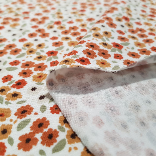 Cotton Jersey Little Flowers Rust Tones fabric - Cotton jersey fabric with drawings of tiny flowers in autumnal or tan tones (rust, orange, beige...) on a white background. The fabric is 145cm wide and its composition is 95% cotton - 5% elastane.