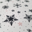 Punto Camiseta Copos Nieve - Tela de punto algodón tipo camiseta con dibujos de puntitos y copos de nieve de color negro y rosa sobre un fondo blanco. Las telas de punto algodón ceden un poco ya que lleva en su composición elast