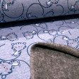 Punto Sudadera Alpenfleece Tigres Sonrientes - Tela de punto sudadera tipo alpenfleece o también llamada sudadera de invierno, con dibujos infantiles de tigres sonrientes sobre un fondo en tono azul. En una de las caras de la tela tiene un pelito muy cort