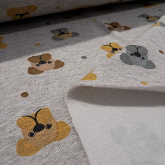 Jogging Alpenfleece Dogs fabric - Alpenfleece jogging fabric, also known as a winter sweatshirt, features children's designs of dog faces on a gray melange background. One side features a very short, soft white pile. The fabric is 150 cm wide and is