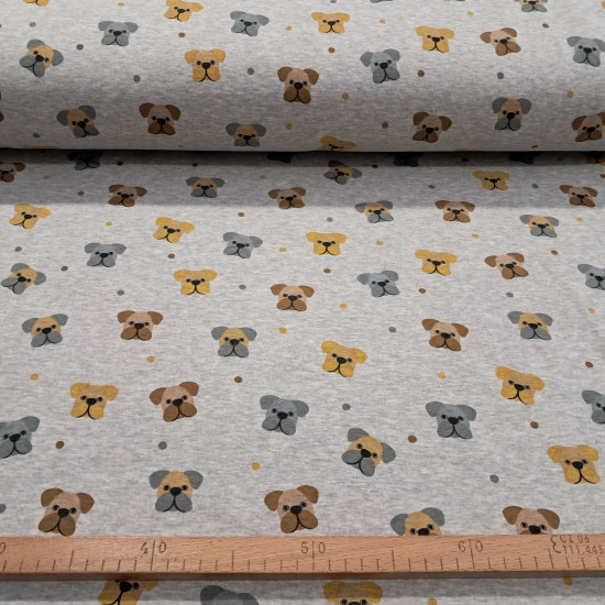 Jogging Alpenfleece Dogs fabric - Alpenfleece jogging fabric, also known as a winter sweatshirt, features children's designs of dog faces on a gray melange background. One side features a very short, soft white pile. The fabric is 150 cm wide and is