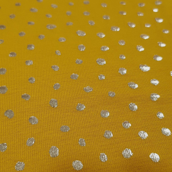 Cotton Jersey Sparks Foil fabric - Cotton jersey fabric, with drawings of sparkles embedded in shiny silver foil on a background of a color to choose from. The fabric is 145cm wide and its composition is 95% cotton - 5% elastane.