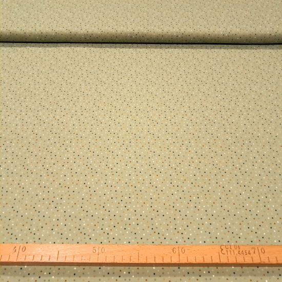 Cotton Jersey Colorful Dots fabric - Cotton jersey fabric with drawings of colored dots on a greenish background. The fabric is 150cm wide and its composition is 95% cotton - 5% elastane.