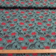 Cotton jersey fabric with red dinosaur print on moss green background