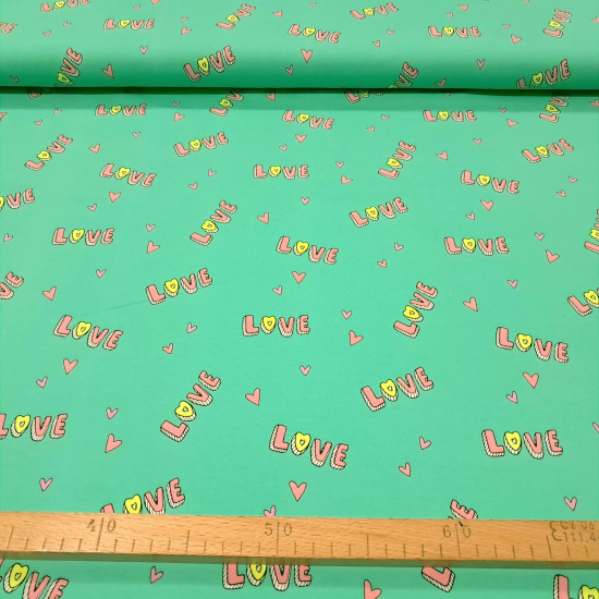 Cotton Jersey Love Neon fabric - Cotton jersey fabric with a drawing of letters 