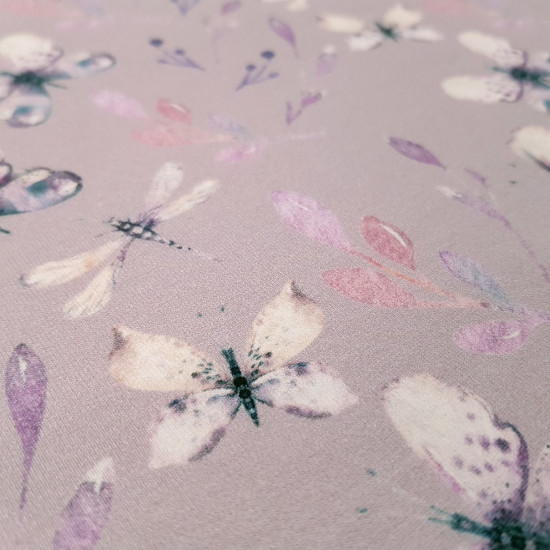French Terry Sweatshirt Butterflies fabric - French Terry Swatshirt fabric, with gigital printing drawings of butterflies and twigs where the background lilac color predominates. The fabric is 150cm wide and its composition is 95% cotton - 5% elastane.