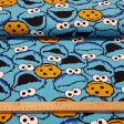Cotton Jersey Cookie Monster fabric - Cotton jersey fabric with funny drawings of the character Triki (The Cookie Monster) from the famous Sesame Street series. The fabric measures 155cm and its composition is 92% cotton - 8% elastane