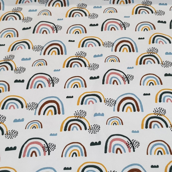 Cotton Jersey Rainbow Clouds fabric - Cotton jersey fabric with drawings of colored rainbows and clouds on a white background. The fabric is 140cm wide and its composition is 94% cotton - 6% elastane.