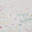 Cotton Jersey Bitty Happy Birthday fabric - Organic cotton jersey fabric with decorative birthday party drawings (confetti, candies, tiny shapes and birthday phrases) on a white background. The fabric is 150cm wide and its composition is 95% cotton - 5% e