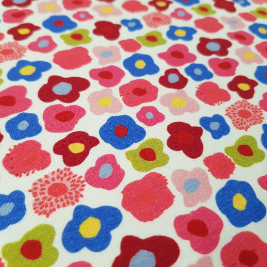 Cotton Jersey Flowers Mauri fabric - Cotton jersey fabric with drawings of colorful flowers in an abstract way on a white background. The fabric is 150cm wide and its composition is 95% cotton - 5% elastane