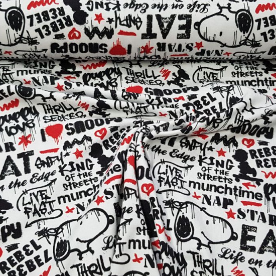 Cotton Jersey Snoopy Rebel White fabric - Organic (GOTS) cotton jersey fabric with drawings of the Snoopy character on a white background decoration with phrases in black letters, graffiti style, and some red tone. The fabric is 145cm wide and its composi