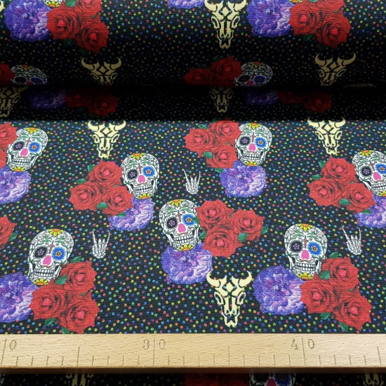Burlington Skulls Multicolor Dots fabric - Stretch / burlington polyester fabric with skulls, roses and multicolored polka dots on a black background. The fabric is 150cm wide and its composition is 100% polyester.