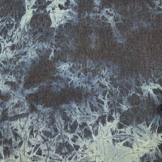 Denim Jeans Tie-Dye 7,5oz fabric Close-up of 7.5 oz cotton denim fabric with a tie-dye pattern in shades of indigo and light blue
