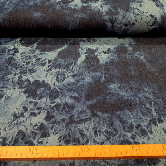 Denim Jeans Tie-Dye 7,5oz fabric Close-up of 7.5 oz cotton denim fabric with a tie-dye pattern in shades of indigo and light blue