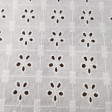 Embroidered Cotton Tiana fabric - Beautiful white embroidered and perforated cotton batiste fabric with large petal flowers. The fabric is 135cm wide and its composition is 100% cotton.