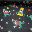 Satin Clowns Black Background fabric - Satin fabric with drawings of colored clowns on a black background. The satin fabric has shine on one side and has quite a drop. The fabric is 150cm wide and its composition 100% polyester.
