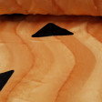 Velboa Flinstones Print fabric - Soft velboa hair fabric with drawings of black shapes on an orange background, typical of Flintstones costumes. The fabric measures 150cm wide and its 100% polyester composition.