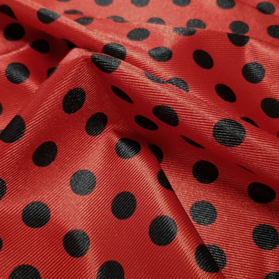 Carnival Satin Ladybug Polka Dot fabric - Carnival satin or trilobal fabric with black polka dot patterns on a red background, imitating the ladybug insect. Ideal for Ladybug’s character costume, for example. The fabric is 150cm wide and its composition 1