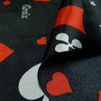 Satin Black Poker Cards fabric - Shiny satin fabric printed with poker card themed drawings, with the symbols of spades, clubs, hearts and diamonds in various sizes and colors on a black background. The fabric is 150cm wide and its composition 100%