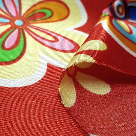Satin Carnival Hippies Flowers Red fabric - Rasete or satin carnival fabric with colorful flower patterns in various sizes on a red background. Very striking fabric ideal for making costumes, since the rasete is a fabric that does not fray. The fabric is 