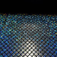 Lycra Silver Scales fabric - Elastic black lycra fabric with silver scale laminate making hologram effect. It is an ideal fabric for carnival, dance and sport dresses. The fabric is 150cm wide and its composition 92% polyester - 8% spandex.