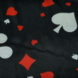 Satin Black Poker Cards fabric - Shiny satin fabric printed with poker card themed drawings, with the symbols of spades, clubs, hearts and diamonds in various sizes and colors on a black background. The fabric is 150cm wide and its composition 100%