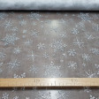 Organza White Ice Flakes fabric - Semi-transparent fabric with white glitter and fall with shiny silver ice flakes. Ideal for Christmas decorations, ice princess costume (Frozen) and much more. The fabric is 150cm wide and its composition 100% polyes