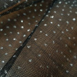 Tulle Dots Glitter Stell fabric - Nylon tulle fabric with irregular glitter dots. A fabric for ideal complement of costumes and party decorations. The fabric is 150cm wide and its composition 100% nylon