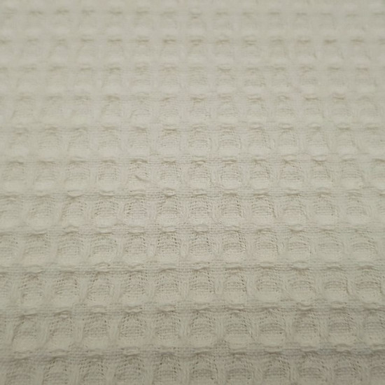 Waffle Cotton fabric - Waffle cotton fabric. The waffle or waffle piqué fabric is characterized by its embossed squares making the shape of a waffle or honeycomb. It is widely used in children's clothing and home. We offer you a waffl