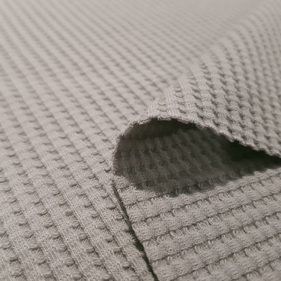 Jersey Waffle Pique fabric - Jersey waffle fabric or also called waffle piqué, with elasticity since in its composition it has, apart from cotton, 5% elastane. The waffle fabric is characterized by its embossed squares or also called honeycom
