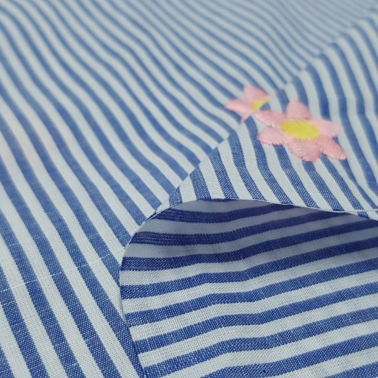Cotton Striped Embroidered Flowers fabric - Cotton fabric with blue stripes pattern and pink embroidered flowers. The fabric is 140cm wide and its composition is 100% cotton.
