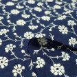 Cotton Embroidered Flowers fabric - Cotton fabric embroidered with drawings of floral motifs. The fabric is 135cm wide and its composition is 100% cotton.