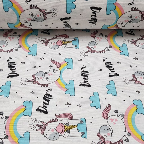 Canvas Dream Unicorn fabric - Decorative canvas fabric with children's drawings of unicorns and rainbows, clouds and stars, on a white background with words 