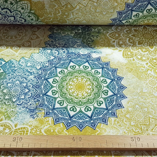 Canvas Mandalas Gradient Colors fabric - Decorative canvas fabric with colorful drawings of mandalas in various shades making a gradient effect. The fabric is 280cm wide and its composition is 50% polyester- 50% cotton.