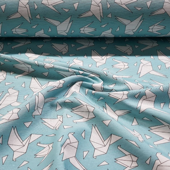 Canvas Origami Birds fabric - Decorative canvas fabric with drawings of birds in the shape of origami on a turquoise background. The fabric is 280cm wide and its composition is 50% cotton - 50% polyester.