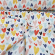 Half Panama Hearts Colors fabric - Decorative fabric half panama with drawings of colored hearts in various sizes on a white background. The fabric of half panama is used a lot in home decorations, as well as some garments. The fabric is 280cm wide an
