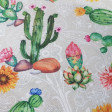Canvas Flowered Cactus fabric - Decorative canvas fabric with drawings of flowered cacti and sunflowers on a light background with white details of floral contours. The fabric is 280cm wide and its composition is 70% cotton - 30% polyester.