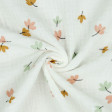 Double Gauze Leaves fabric - Organic cotton muslin or double gauze fabric with drawings of colored leaves on a white background. The fabric is 135cm wide and its composition is 100% cotton.