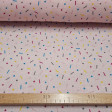 Double Gauze Confetti fabric - Cotton double gauze / muslin fabric with colorful confetti drawings, widely used in childcare and light clothing. The fabric is 135cm wide and its composition is 100% cotton.