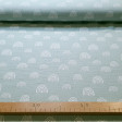 Doble Gasa Arcoiris Trazos Blancos - Tela de doble gasa algodón o muselina con dibujos de arcoiris en trazos blancos sobre un fondo de color verde menta y ocre. La tela mide 135cm de ancho y su composición 100% algodón.