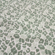 Double Gauze Animal Print fabric - Double gauze or two-layer muslin cotton fabric with green animal print designs on a white background. The fabric is 135cm wide and is made from 100% cotton.