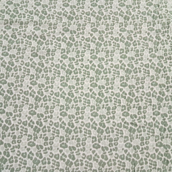 Double Gauze Animal Print fabric - Double gauze or two-layer muslin cotton fabric with green animal print designs on a white background. The fabric is 135cm wide and is made from 100% cotton.